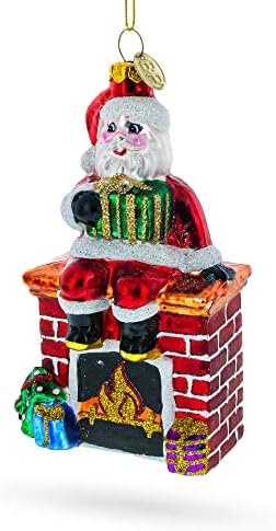 Santa sjedi na kamin staklo Božić Ornament